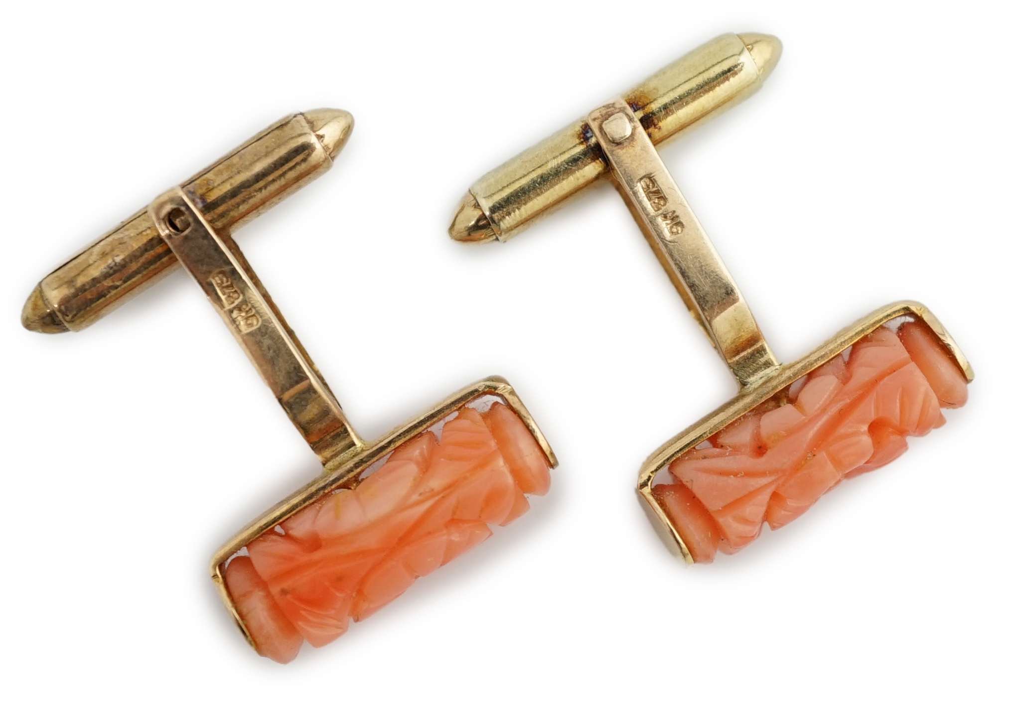 A pair of 9k gold and carved coral set cufflinks